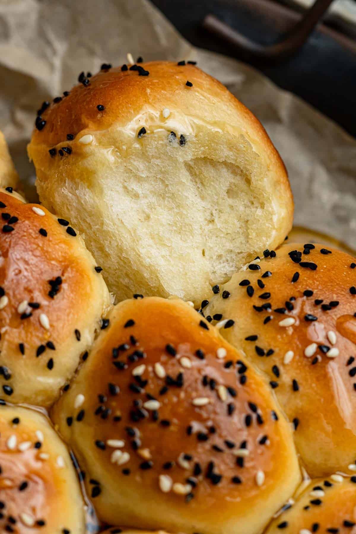 piece of yemeni honeycomb bread on its side to show the softness of the dough