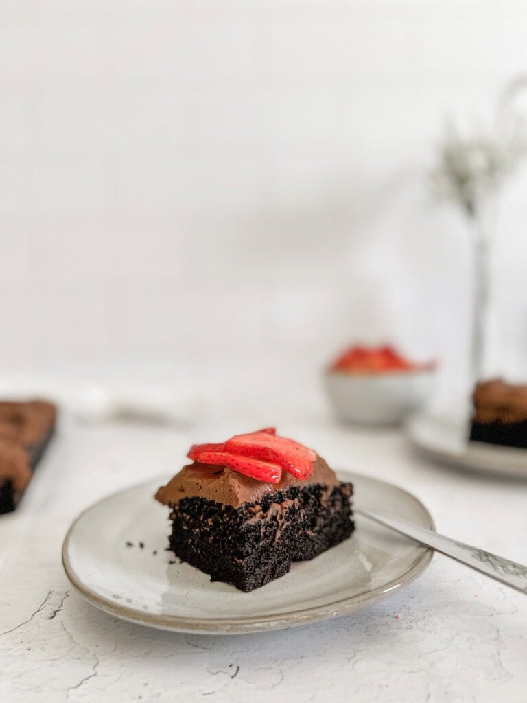 dairy-free chocolate cake with dairy-free chocolate frosting with strawberries