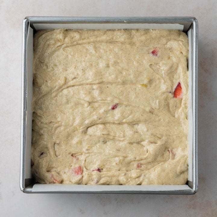 strawberry banana cake batter in a pan before baking