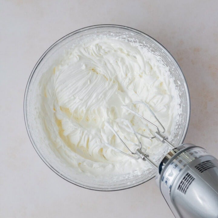 Beat heavy cream until it forms stiff peaks