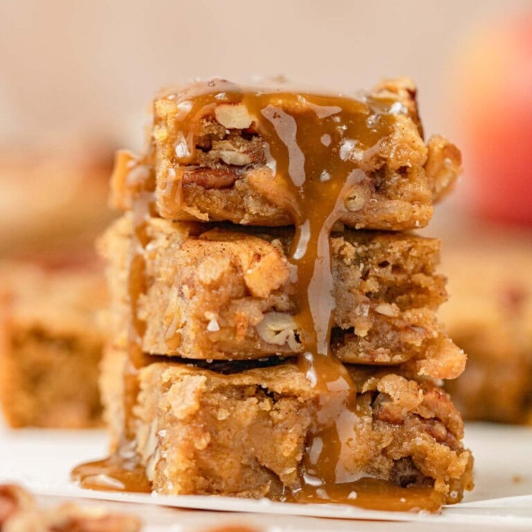 stack of brown butter apple blondies with butterscotch sauce