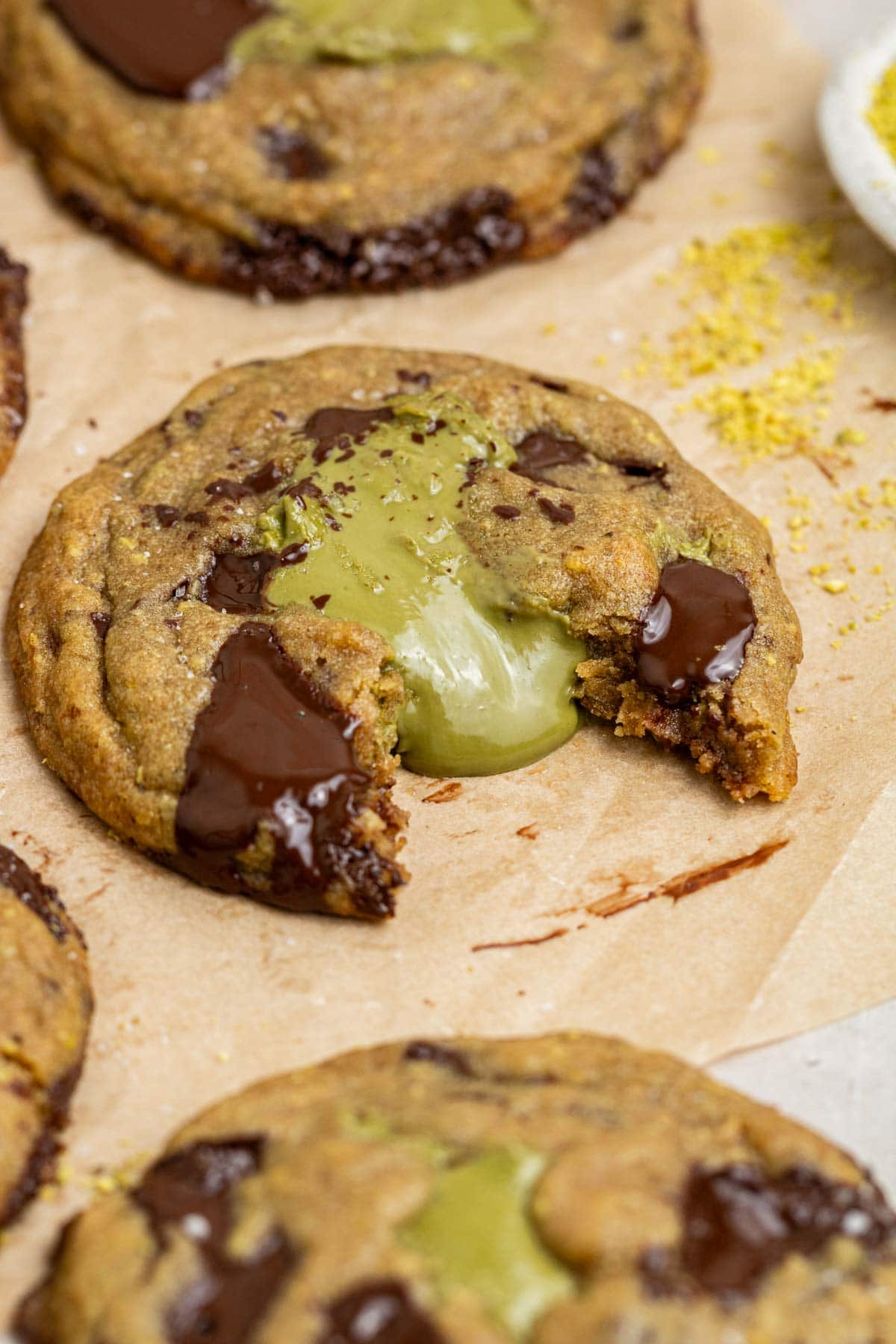 pistachio stuffed cookies with pistachio cream oozing out of the cookie