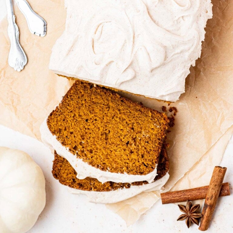 Frosted Pumpkin Bread on parchment paper