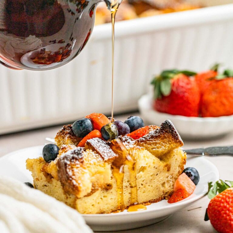 Brioche baked french toast casserole with maple syrup poured on top