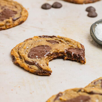 bite taken out of brown butter chocolate chip cookie