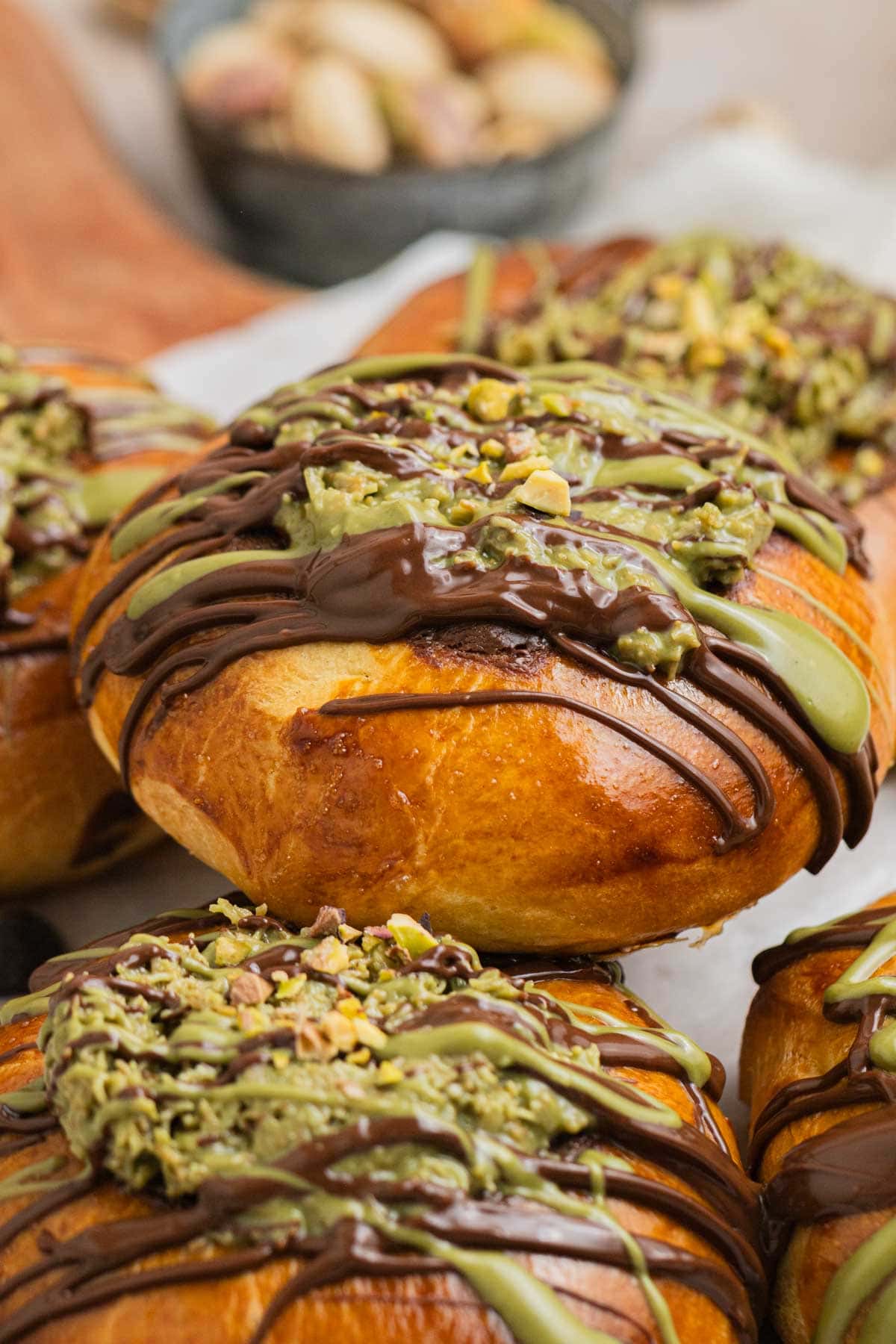 dubai chocolate brioche buns on wooden serving platter