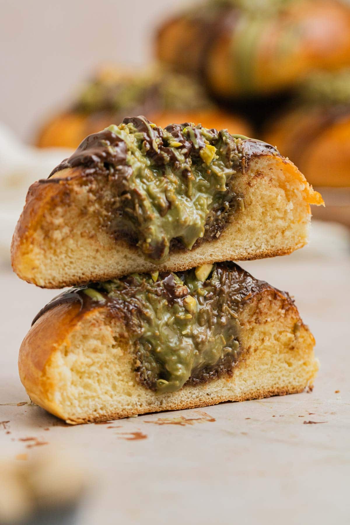cross shot of filling oozing out of dubai chocolate brioche bun