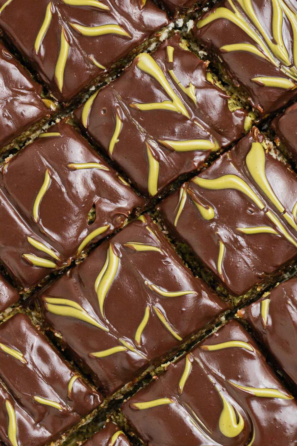 slices of dubai chocolate cheesecake bars with chocolate ganache 