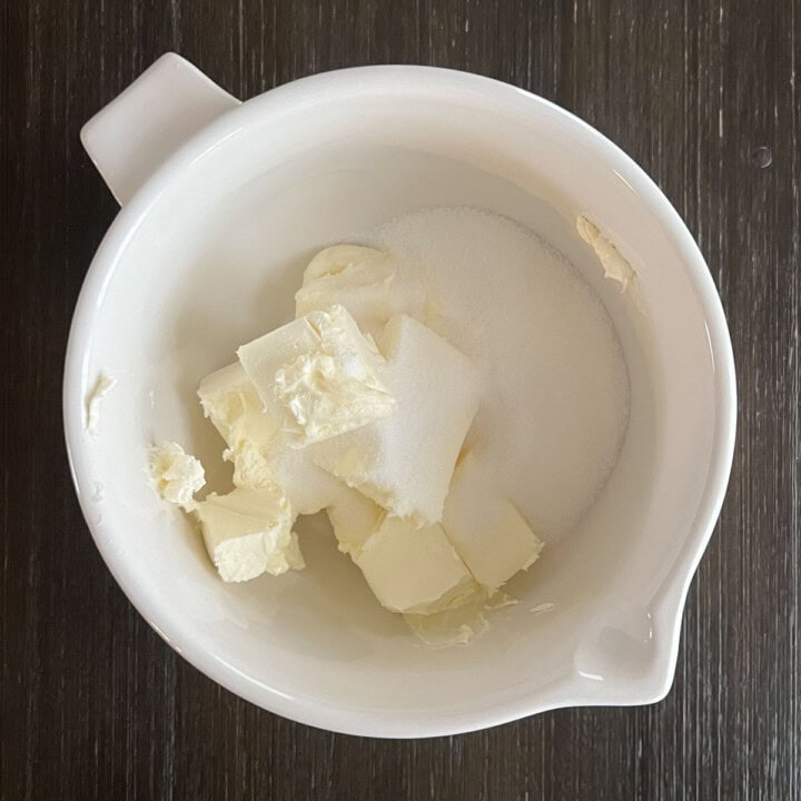 Make cheesecake - cream the sugar and cream cheese
