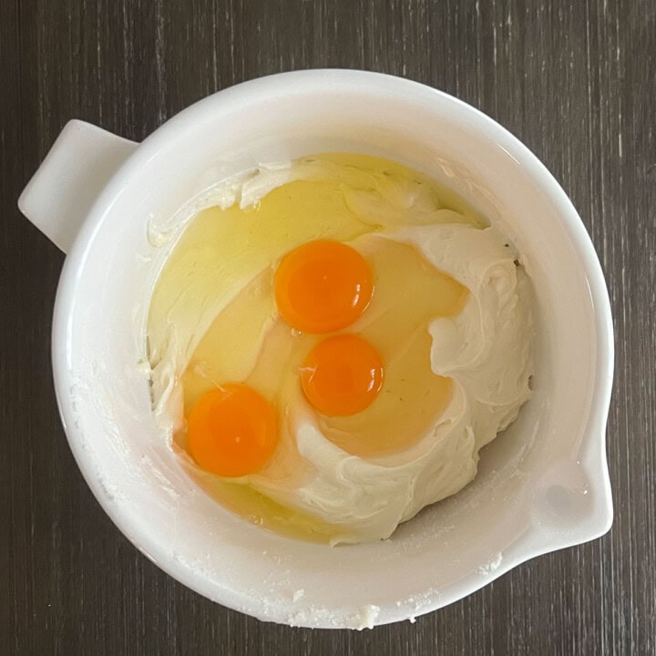 add eggs to cheesecake filling