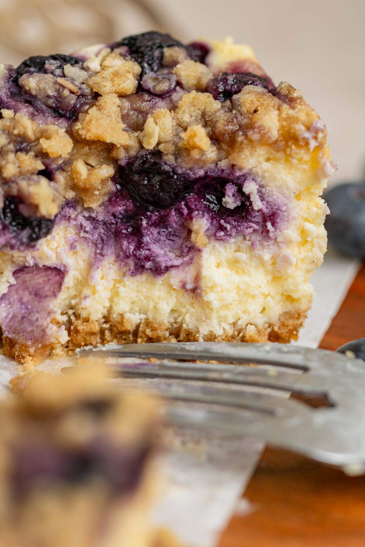 fork lines on a cheesecake bar with fork sitting in front of it