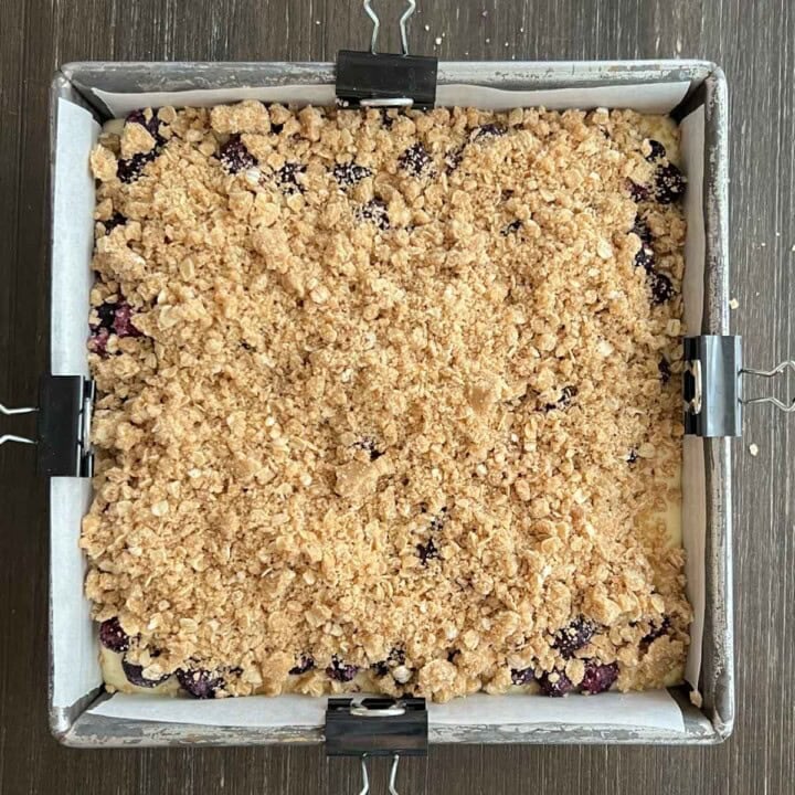 crumble topping over blueberry cheesecake