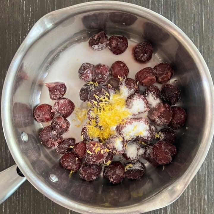 cherry compote ingredients in a pot before cooking
