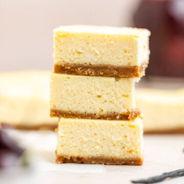 stack of vanilla bean cheesecake bars