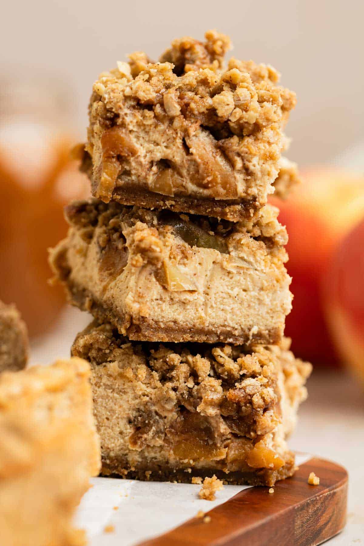 cheesecake bars topped with spiced apples and apple crisp