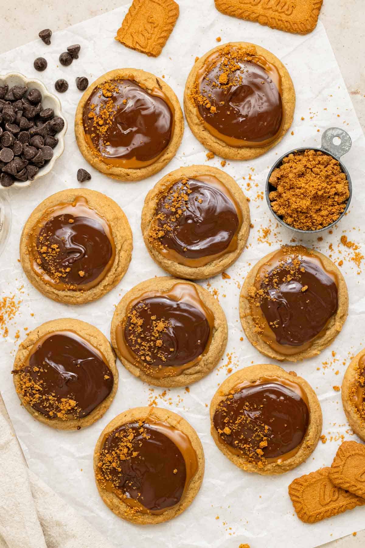 cookie butter cookies with melted biscoff spread and melted chocolate topped with crushed biscoff cookies