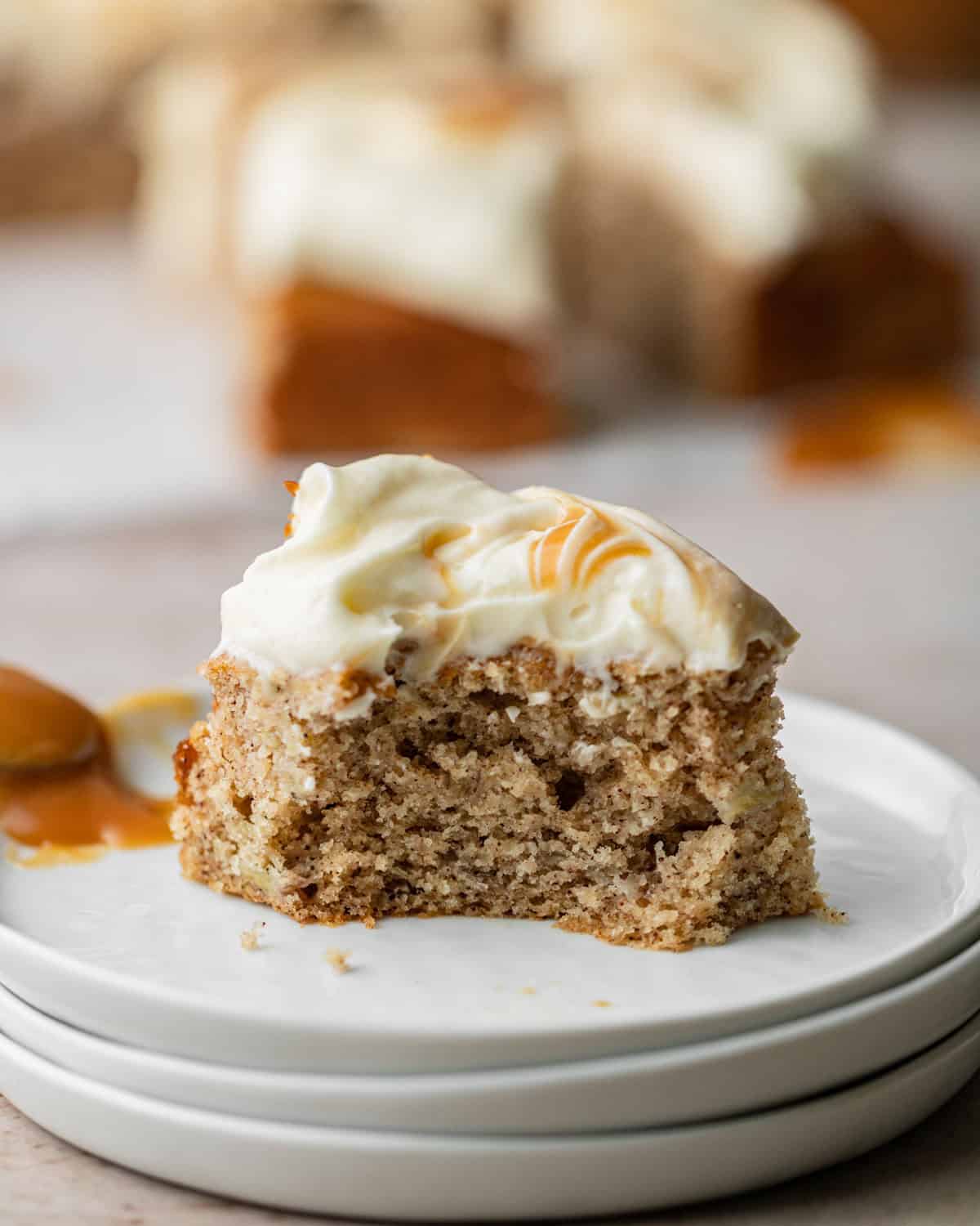 a bite taken out of a slice of spiced banana cake